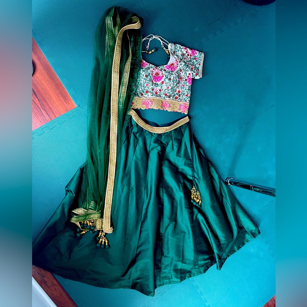 Indian lehenga choli dress for wedding, with matching jewelry